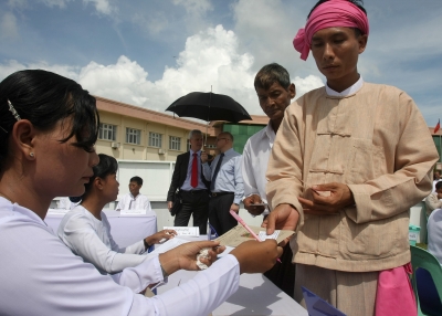 Myanmar voters queue to collect their ballot papers during a demonstration of how to vote in Naypyidaw. (Soe Than Win/AFP/Getty Images)