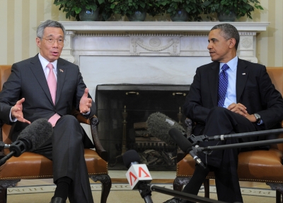 U.S. President Barack Obama (R) listens as Singapore’s Prime Minister Lee Hsien Loong speaks to the media before their bilateral meeting in the Oval Office at the White House in Washington, D.C., on April 2, 2013. (Jewel Samad/Getty Images)