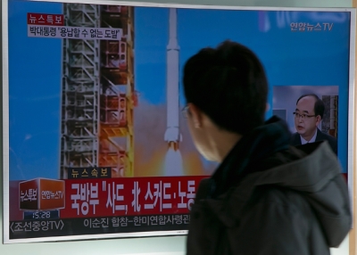 People watch a television screen showing a breaking news on North Korea's long-range rocket launch at Seoul Station on February 7, 2016 in Seoul, South Korea. (Han Myung-Gu/Getty Images)