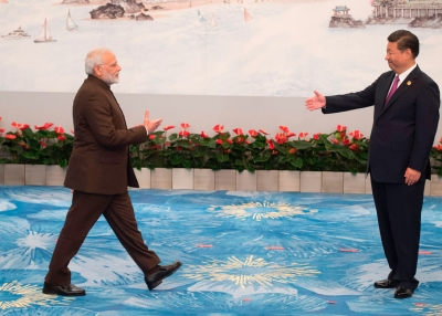 Chinese President Xi Jinping (R) welcomes Indian Prime Minister Narendra Modi for a banquet dinner during the BRICS Summit in Xiamen, Fujian province on September 4, 2017. (Fred Dufour/AFP/Getty Images)