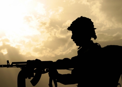 An Afghan soldier stands guard in an armoured vehicle in Kabul, 09 August 2007. (Massoud Hossaini/AFP/Getty Images)