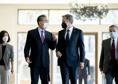 U.S. Secretary of State Antony Blinken (R) and China's Foreign Minister Wang Yi talk before a meeting in Nusa Dua on the Indonesian resort island of Bali on July 9, 2022.