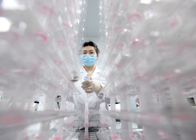 A laboratory technician conducting artificial intelligence (AI)-based cervical cancer screening at a test facility in Wuhan, China