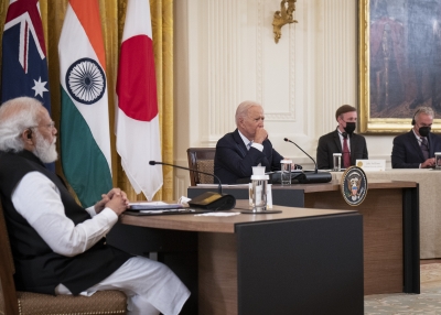 U.S. President Joe Biden (C) and Indian Prime Minister Narendra Modi (L) listen during a Quad Leaders Summit with Australian Prime Minister Scott Morrison and Japanese Prime Minister Suga Yoshihide in the East Room of the White House on September 24, 2021 in Washington, DC.
