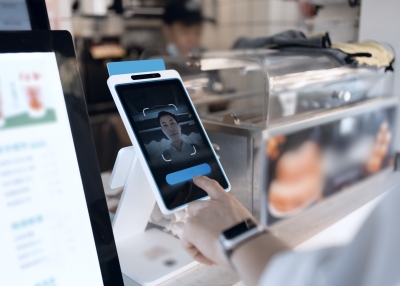 Asian man is using facial recognition for payment 