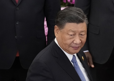 Chinese President Xi Jinping heads to a group photo session