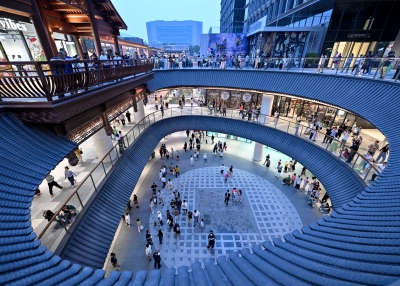 People visit the Dajixiang, a newly-renovated historical courtyard and shopping complex, in Beijing on June 1, 2025.