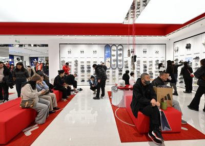 People visit a new shopping mall at the Tongzhou district of Beijing on December 26, 2025