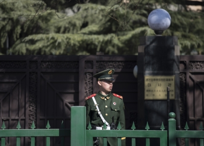 A Chinese paramilitary police officer stands at the entrance of the North Korean embassy in Beijing on March 8, 2017. China's foreign minister called for North Korea to suspend its nuclear and missile activities, and for the US and South Korea to halt military exercises to cool what he called a looming security "crisis."
