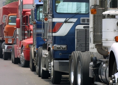 A queue of trucks, similar to those which transport goods inter-state and across national borders, stands 04 August 2001 in Mexico City. (Ramon Cavallo/AFP/Getty Images)