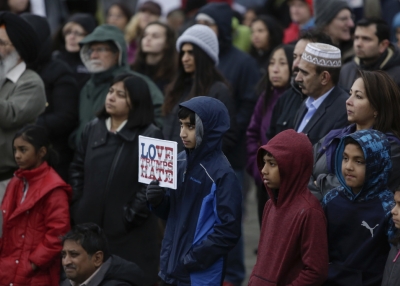 Members of the South Asian community and others attend a peace vigil for Srinivas Kuchibhotla, the 32-year-old Indian engineer killed at a bar Olathe, Kansas, in Bellevue, Washington on March 5, 2017. (Jason Redmond/AFP/Getty Images)