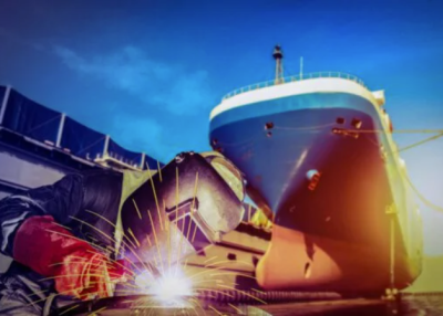 Welder working on a shipyard